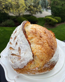Freshly baked sourdough bread on a white plate, Runcible Spoon Bakery