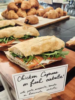 Chicken Caprese sandwich on ciabatta with croissants at Runcible Spoon Bakery.