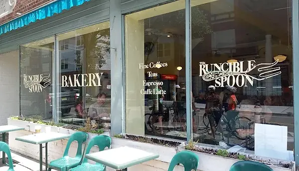 Runcible Spoon Bakery with bakery sign and outdoor seating, Fine Coffee, Tea, Espresso